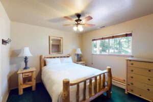 bedroom with wood carved queen bed