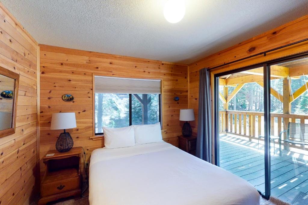 bedroom with wood walls