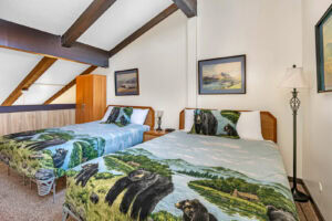 loft bedroom with two full beds