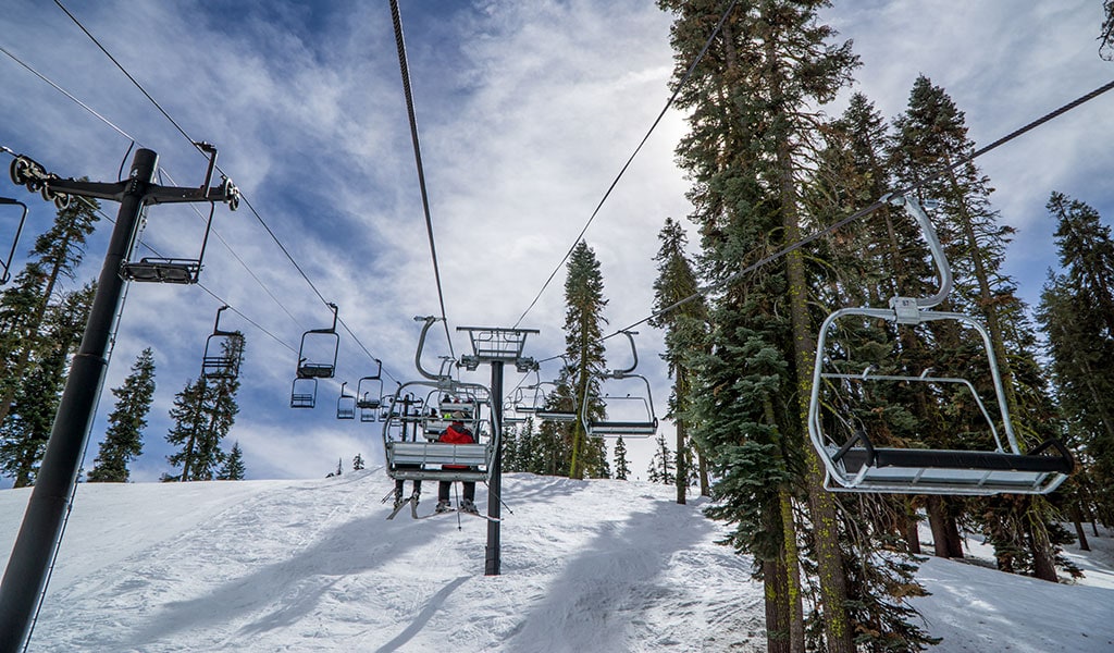 Riding the chair lift at Badger Pass Ski and Snowboard Area