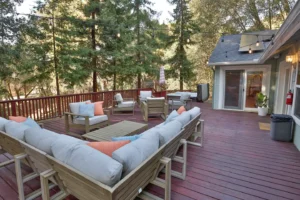 deck with outdoor seating and fire pit