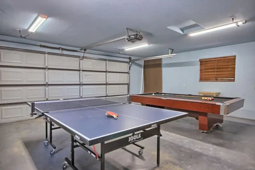 garage game room with ping pong and pool tables