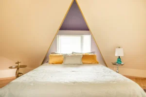 bedroom with pitched ceiling and queen bed