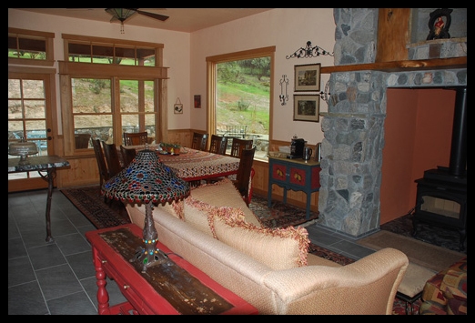 living room with couch and wood stove