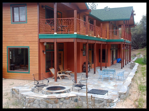 patio with seating and fire pit and exterior of home