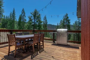 deck with outdoor seating and grill