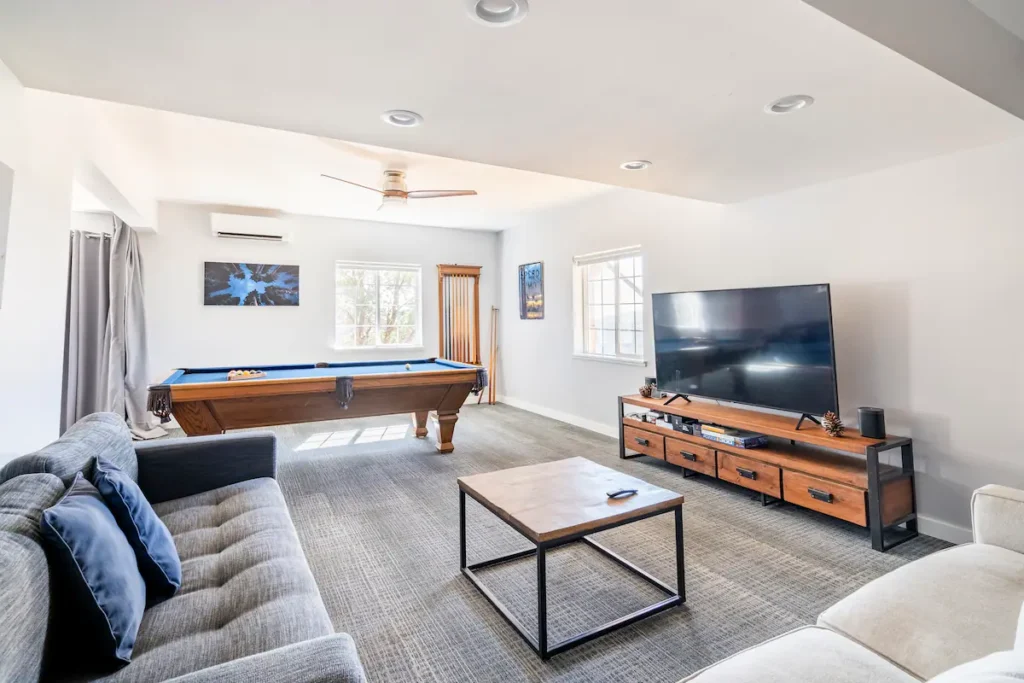 game room with television and couches