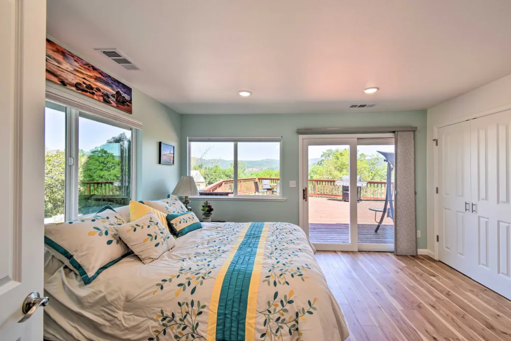 bedroom with queen bed and deck access