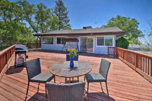 deck with outdoor seating and grill