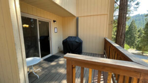 deck with grill and outdoor seating