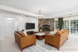 living area with television fireplace and seating