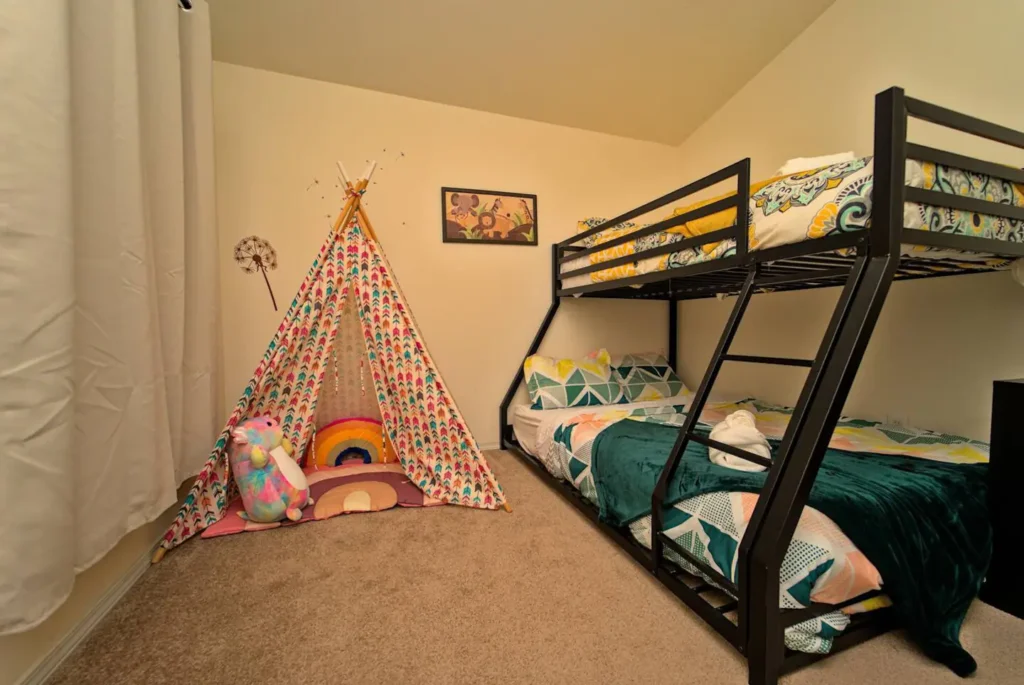 bedroom with bunk beds and fort