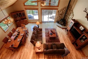 living room view from loft, fireplace, and couches