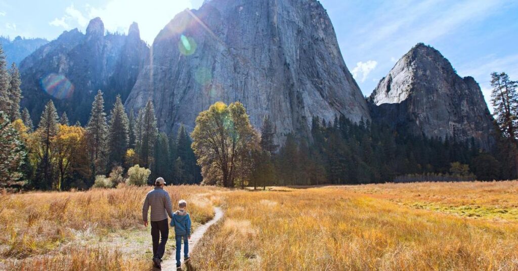 Family walking in El Capitan Meadow