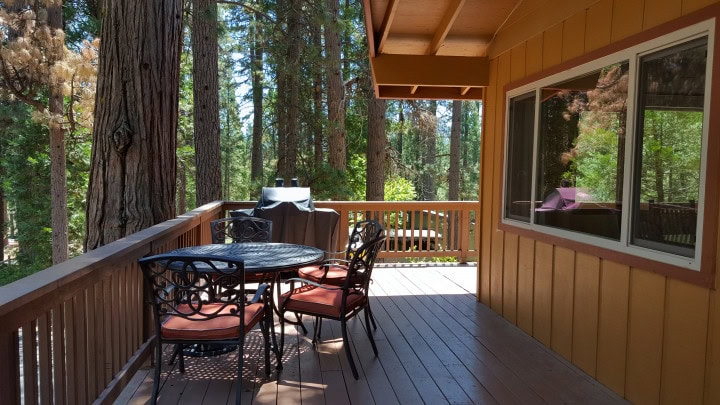 deck with outdoor seating and grill