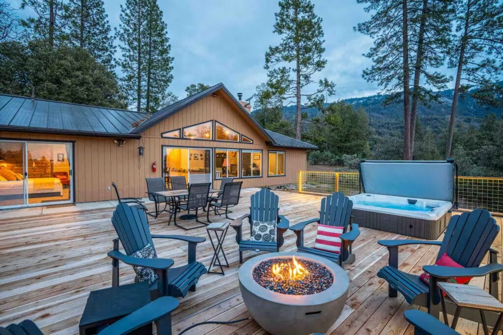 back patio with seating fire pit and hot tub