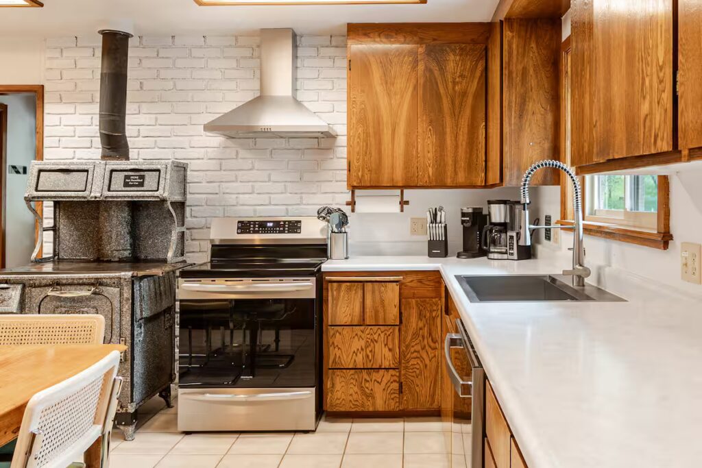 fully equipped kitchen with decorative wood stove