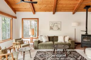 living room with seating and wood paneled ceiling