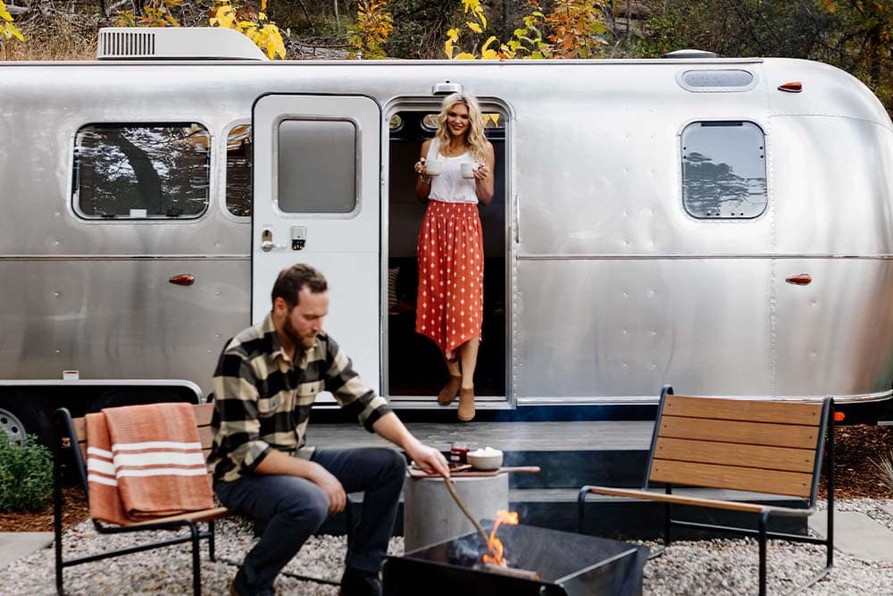 couple at airstream rental in yosemite mariposa county